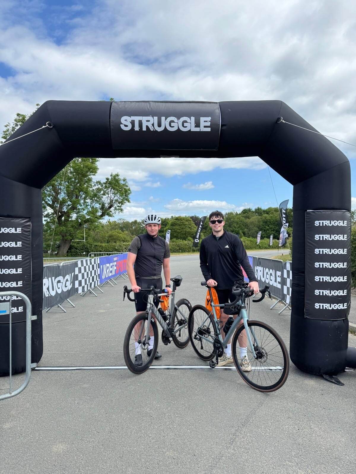 Cole and Henry biking for UKREiiF ride the struggle